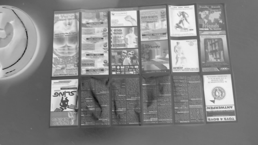 black and white inverted leaflet of gay adverts 