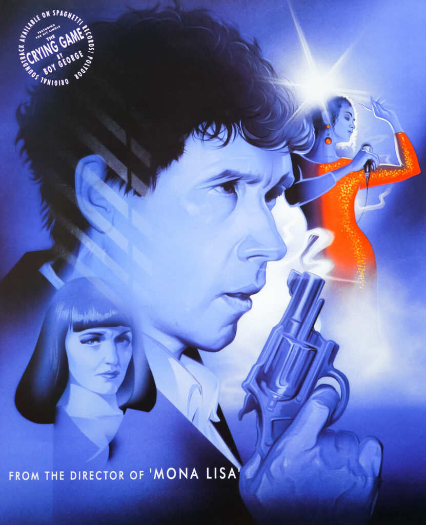 Blue hued portrait film poster for The Crying Game. The main image is a drawing of Stephen Rea's face in profile holding up a gun to the left of the image. In the bottom left is a drawing of Miranda Richardson looking disapproving. In the top right is a drawing of Jaye Davidson in a red glittering dress singing with a microphone in hand.